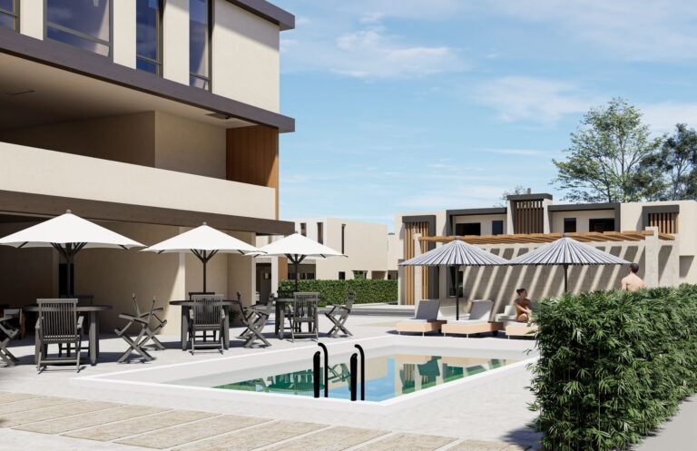 Terraza con sombrillas junto a la piscina de la Casa Club